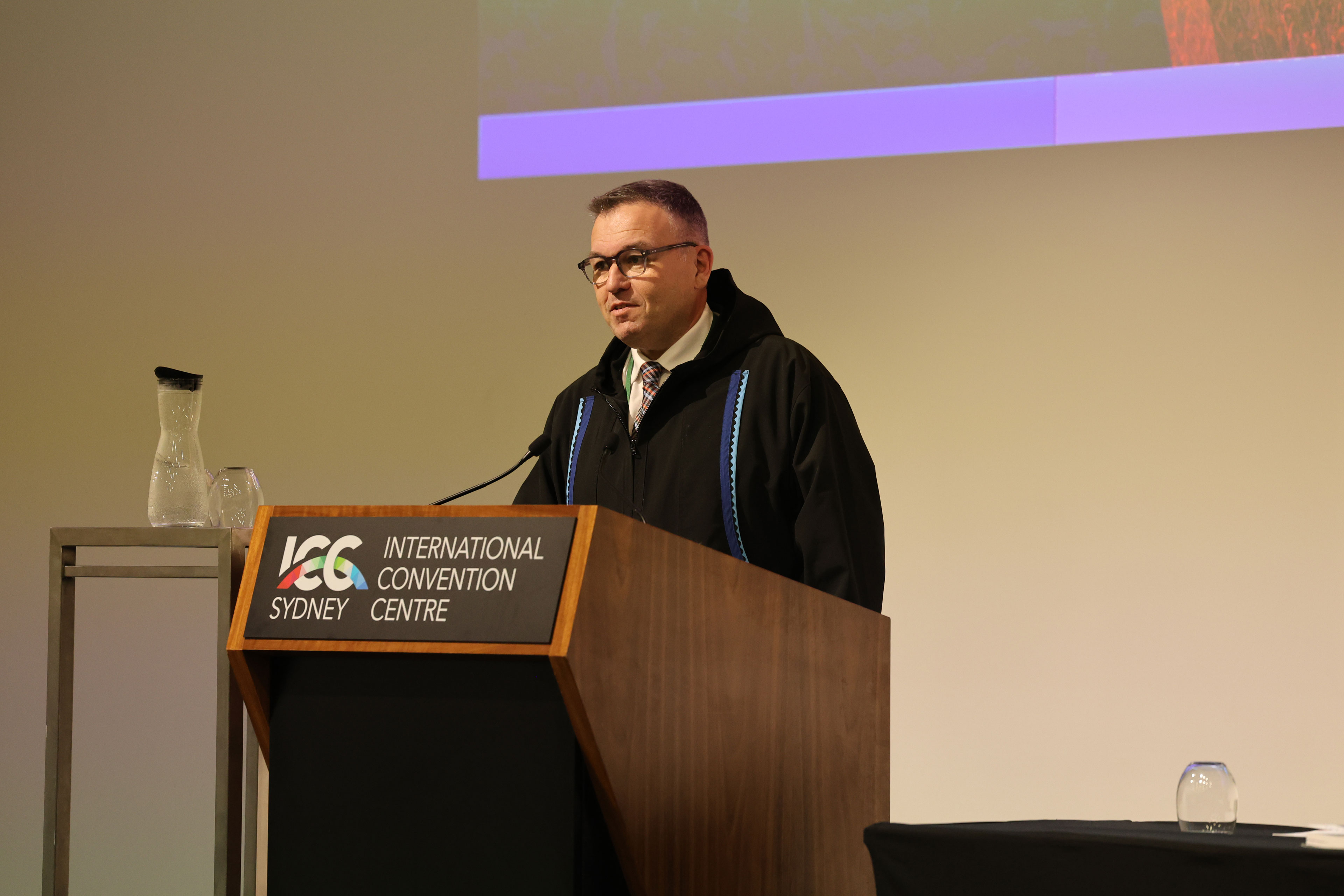 SOCATT Sydney 2024 delegate Glen Rutland, Clerk, Northwest Territories Legislative Assembly, Canada, addressing attendees